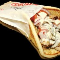 Chicken Shawarma Wrap · A mixture of marinated chicken breast and thighs cooked to perfection on a rotisserie agains...
