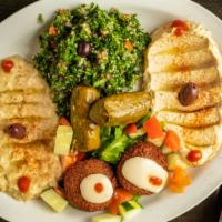Mediterranean Sampler · Vegetarian. Hummus, Baba ganoush, tabouli, falafel (2) and dolmades (2).