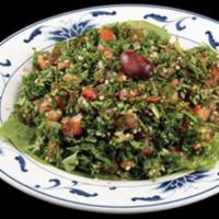 Tabouli · Vegetarian. A mixture of cracked wheat and finely chopped parsley, tomatoes, and onions, dre...