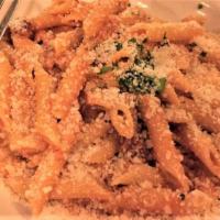 Penne Alla Vodka · Penne with imported pancetta, peppercorns, green onions, and vodka tomato cream sauce.