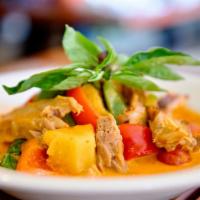 Red Curry Duck · Sliced boneless roasted duck simmered in red curry coconut milk, bell pepper, pineapple, tom...