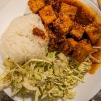 Spicy Tofu Scampi · deep-fried tofu sautéed with garlic, white wine, and sweet chili sauce, topped w/ spicy cabb...