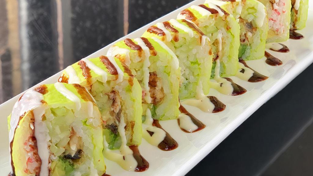 Green Monster Roll · Deep fried eel, crab meat, cucumber, avocado wrapped in soy paper, topped w/white sauce, seaweed.