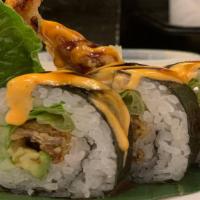 Spider Roll · Soft shell crab, cucumber, avocado, lettuces inside, topped w/ spicy may, eel sauce.