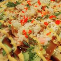 Sushi Pizza · Fried tortilla topped with spicy tuna, crunch, avocado, crab ,eat, spicy mayo, eel sauce, sc...