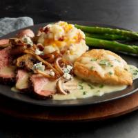 The Tri-Tip Prospector · Slow-roasted Tri-Tip and seared chicken smothered in a caramelized onion and mushroom bleu c...