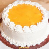 Mangolicious Cake · Fluffy chiffon cake, filled, iced and topped with whipped cream and pureed mangoes