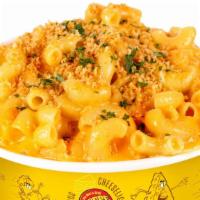 Classic Mac N’ Cheese · Our succulent house cheese sauce, elbow pasta, topped with toasted bread crumbs.