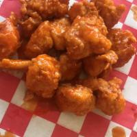 The Boneless Satisfier Combo · Nine Meaty juicy boneless wings with just the right crunch! Two flavors of your choice. Frie...