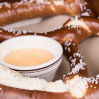 The Gigantic Pretzel · A one-pound giant pretzel served with our creamy beer cheese sauce, featuring grain belt pre...