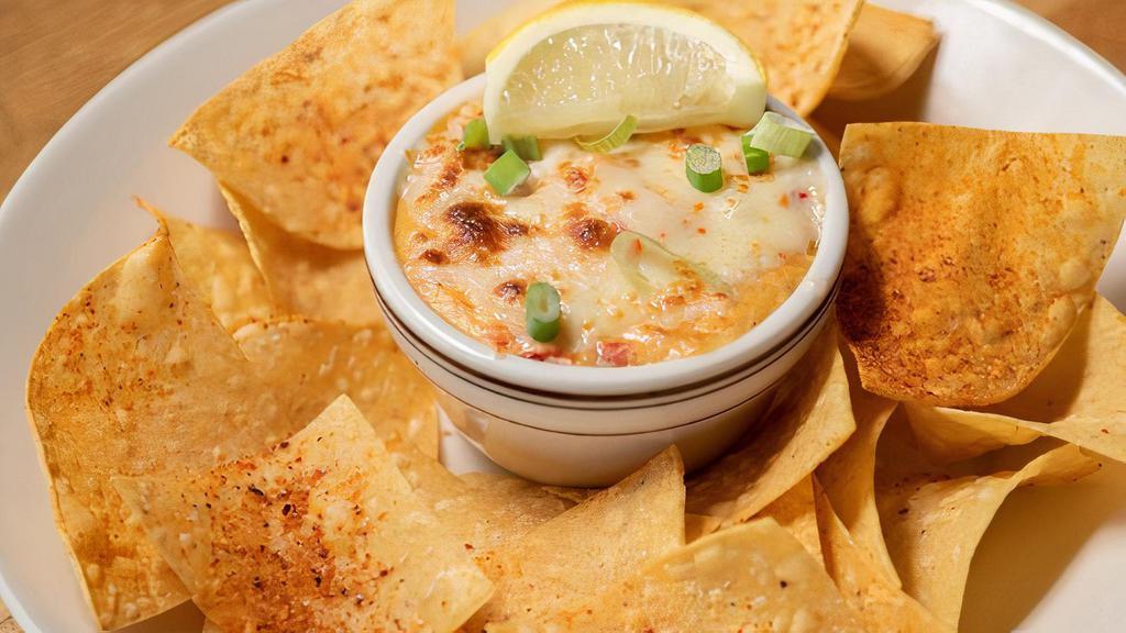 Pimento Cheese Crab Dip · Creamy crab dip topped with pepper jack cheese and served with tortilla chips.
