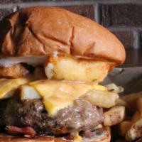 Poutine Lucy · American cheese-stuffed patty with chopped bacon, mayo, pub fries, American cheese, cheese c...
