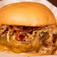 Wrangler Lucy · Stuffed with jalapeños and cheddar, topped with cheddar, bacon, haystack onions, and bourbon...