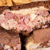 Reuben · Slow-roasted certified Angus corned beef with thousand island, swiss, Monterey jack, and kra...