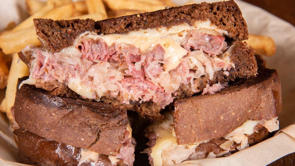 Reuben · Slow-roasted certified Angus corned beef with thousand island, swiss, Monterey jack, and kraut on pumpernickel.