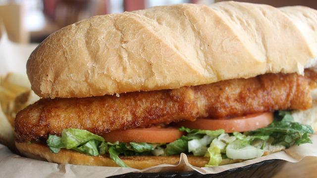Walleye Sandwich · Beer-battered walleye on a hoagie with romaine, tomato, and served with a side of tartar sauce.