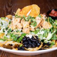 Taco Salad · Gluten-free. Your choice of chipotle chicken or beef with tortilla chips, romaine, pico, avo...