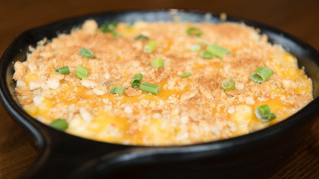 Mac ‘N’ Cheese Skillet · Our beer cheese sauce, ground beef, garlic, pepper jack and cheddar cheeses, toasted bread crumbs, and topped with green onions.