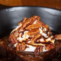 Turtle Brownie · Brownie topped with caramel and chocolate sauces, whipped cream, and glazed pecans. Add ice ...