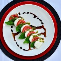 Caprese Salad · Roma Tomato, Fresh Mozzarella, Pesto, Balsamic Glaze.