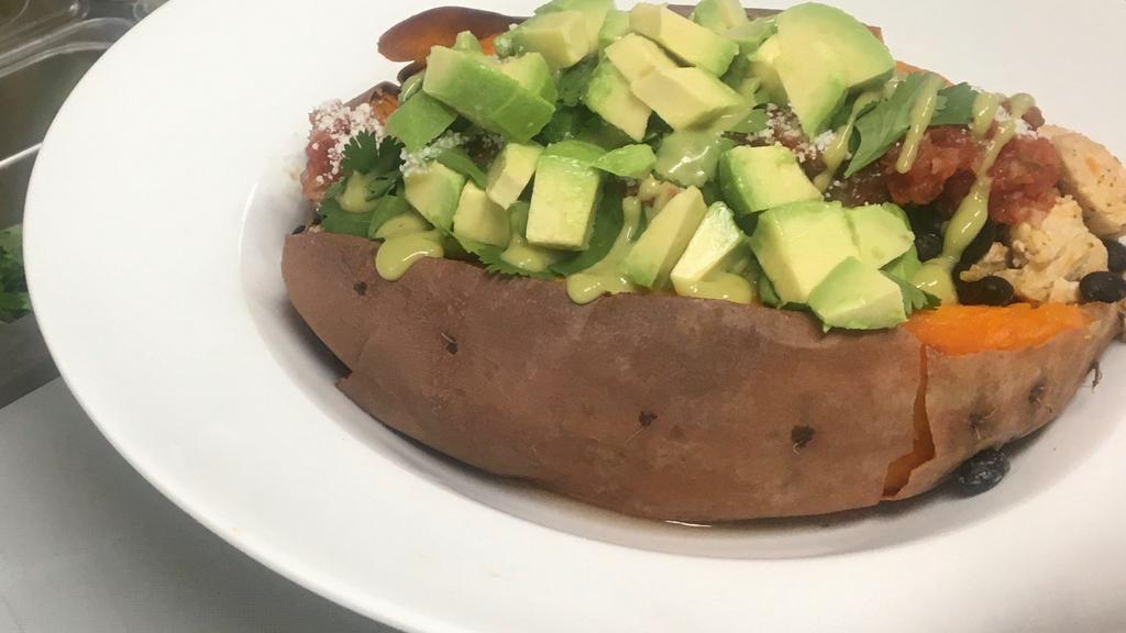 Sweet Potato Vegetarian *Gf · Organic Black Beans, house Salsa (on  the side), Cotija Cheese, Cilantro, drizzled with Avocado dressing and topped with diced Avocado all stuffed into a baked Jumbo Sweet Potato.