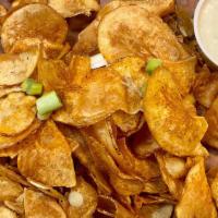 Truffle Potato Chips · White Truffle Oil/Bleu Cheese Fonduta/
Scallions