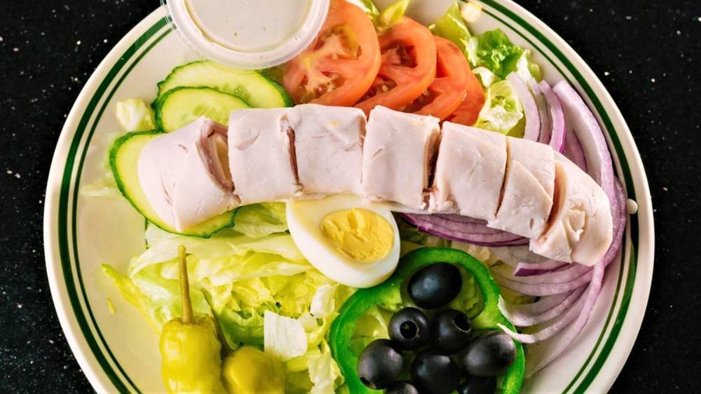 Chef Salad · lettuce, onion, tomato, olives, cucumbers, green peppers, pepperoncini, egg, ham, turkey, provolone.