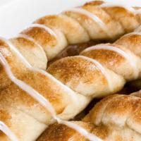 Cinnamon Dessert Sticks · 8 warm and sweet cinnamon breadsticks with a creamy vanilla icing.
