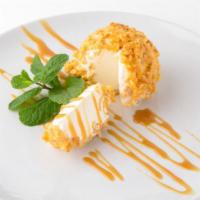 Fried Ice Cream · A big yummy scoop of vanilla ice cream rolled in corn flakes and fried in dusted cinnamon su...