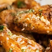 Garlic Parmesan Wings · Deep fried wings tossed in a flavorful garlic and Parmesan sauce.