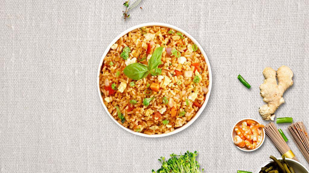 Thai Fried Rice · Stir-fried rice with egg, tomatoes, peas and carrots, onions, topped with chopped cilantro and green onions.
