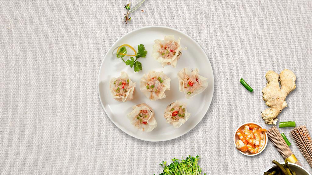 Chinese Dumpling (Shumai) (4 Pcs) · Steamed house-made dumplings filled with shrimp, chicken, shiitake mushrooms, and water chestnuts. Served with our house-made ginger-soy sauce.