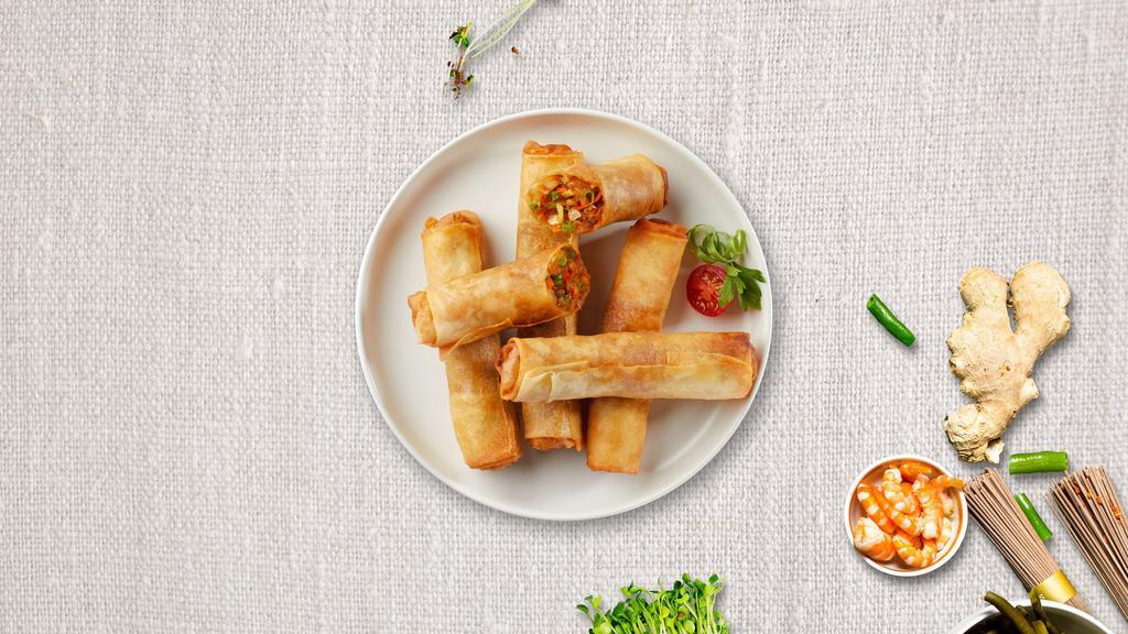 Crispy Spring Roll (4 Pcs) · Deep-fried house-made vegetarian spring rolls. Served with sweet chili sauce.