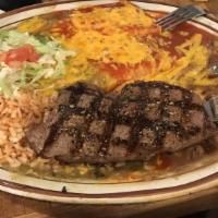 Steakalada · 8 oz. sirloin served with choice of two rolled cheese, chicken or beef enchiladas topped wit...
