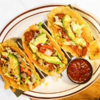 Taco Plate · Choice of three soft flour, hard corn or grilled corn tortillas filled with beef, chicken or...
