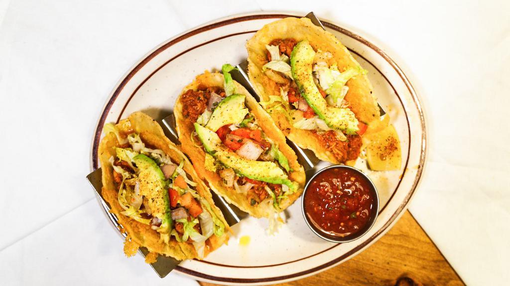 Taco Plate · Choice of three soft flour, hard corn or grilled corn tortillas filled with beef, chicken or carne, topped with shredded lettuce, tomato and cheese. Served with salsa and sour cream.