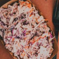 Coleslaw - 8 Oz · Fresh Heads of Green and Red Cabbage & Carrot shredded in house mixed with Apple Vinegar...
