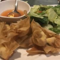 Crab Rangoon (8) · crispy wonton filled with cream cheese and crab meat.