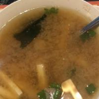 Miso Soup · Traditional Japanese Miso soup with tofu and seaweed.