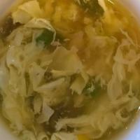 Egg Drop Soup · Minced chicken, Peas, carrots, corn, egg blossom in chicken broth.