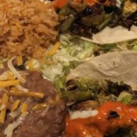 Signature Tacos · Choice of two tacos. Choose from Carnitas (shredded pork and fajita veggies), Fish (sauteed ...