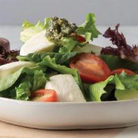 Side Caprese Salad · Mixed greens topped with grape tomatoes, mozzarella cheese, pesto, and balsamic vinaigrette.