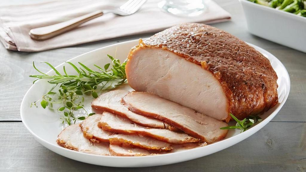 Honeybaked Roasted Turkey Breast · Slow-roasted and seasoned with the perfect blend of herbs and spices for a juicy, tender and delicious Roasted Turkey experience. HoneyBaked has changed boring, predictable turkey. You may think you've had turkey before, but if you've never had Honey Baked Turkey Breast, you have a whole new experience in store. Turkey has never tasted so good! Slow-roasted and perfectly seasoned for the most juicy, tender and delicious taste infused into every bite. It's indulgence as its best - everyone loves it. We think you'll agree that this turkey is like no other - and is the World's Best Turkey. Premium 100% white breast meat and hand-crafted in store with our sweet crunchy glaze. Fully cooked, pre-sliced and ready to serve. 2.5 - 3 lbs. Serves 6-8