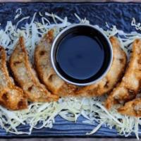 Crispy Gyoza · six golden crispy fried vegetable dumplings served with black vinegar sauce