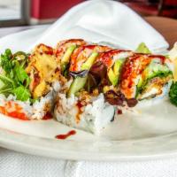 Spider Roll · Soft shell crab, avocado, cucumber, caviar & lettuce with eel sauce.