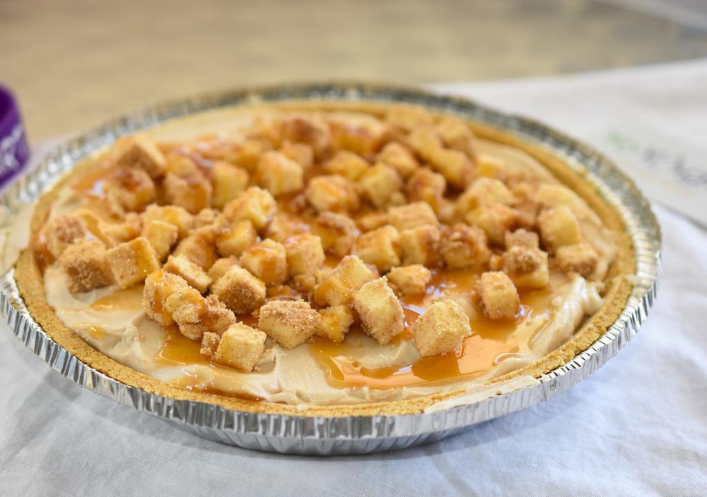 Caramel Cheesecake Pie · A decadent graham cracker crust with  Cheesecake frozen yogurt, topped with delicious cheesecake bites and caramel drizzle.