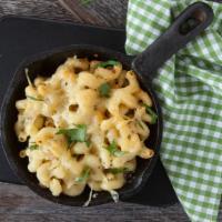 Mac And Cheese Skillet Deluxe · Cheesy mac with crispy crumb topping with bacon or pulled pork with house sauce.