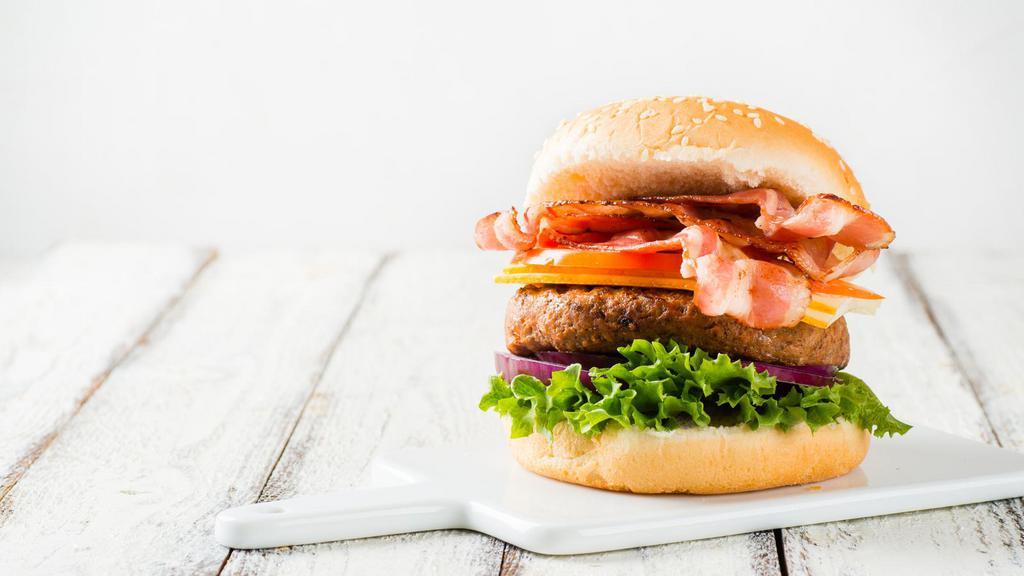 Bbq Bacon Burger · Delicious 2 slices thick bacon and house sauce.