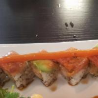 Richard Roll · Tempura shrimp, spicy crab, cream cheese, topped with spicy tuna, and avocado.