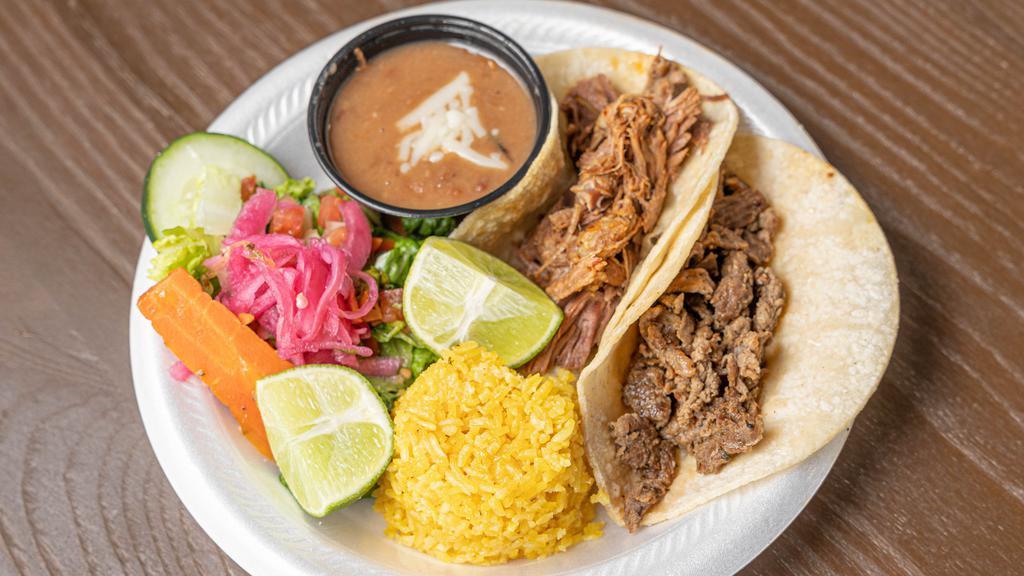 Taco Meal · Two tacos filled with your choice of protein, served with rice, beans and a side salad.